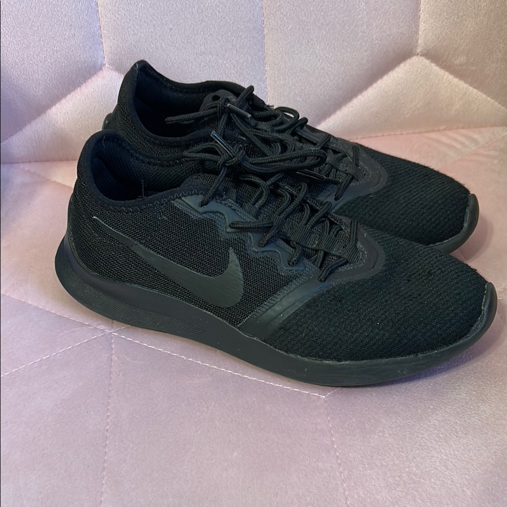 Women’s black Nike running shoe